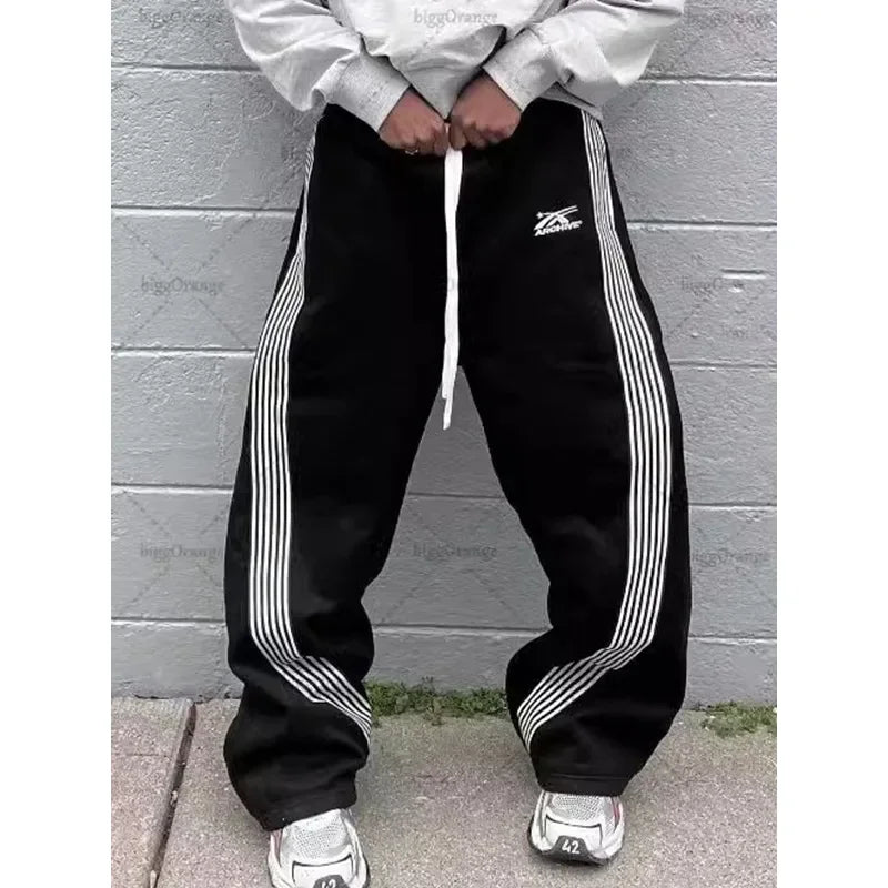 Pantalones deportivos de pierna recta holgados a rayas informales para hombre