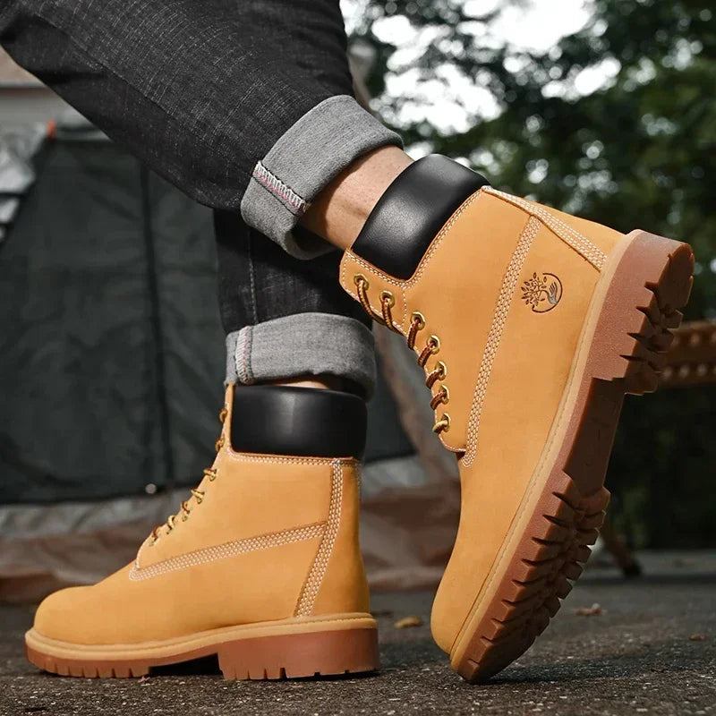 Botas altas de cuero para hombre y mujer, zapatos de alta calidad, zapatillas de deporte para exteriores, botines antideslizantes con cordones para pareja