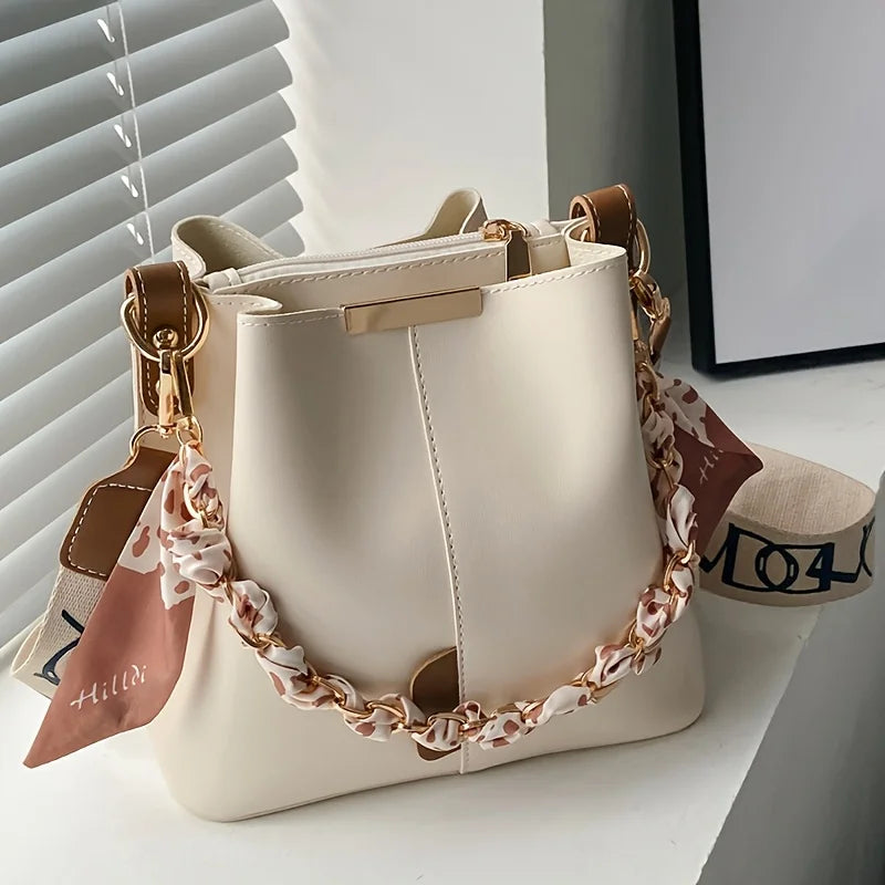 Nuevo bolso de hombro a la moda para mujer, bolso tipo cubo con cadena de cinta de gran capacidad, bolso cruzado para desplazamientos diarios