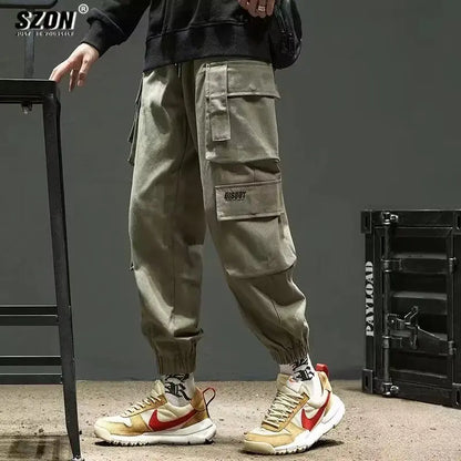 Pantalones deportivos holgados con múltiples bolsillos para primavera y verano, estilo urbano para hombre, con cordón en la cintura, pantalones cargo para fitness al aire libre.