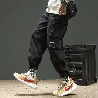 Pantalones deportivos holgados con múltiples bolsillos para primavera y verano, estilo urbano para hombre, con cordón en la cintura, pantalones cargo para fitness al aire libre.