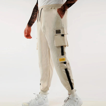 Pantalones deportivos holgados con múltiples bolsillos para primavera y verano, estilo urbano para hombre, con cordón en la cintura, pantalones cargo para fitness al aire libre.