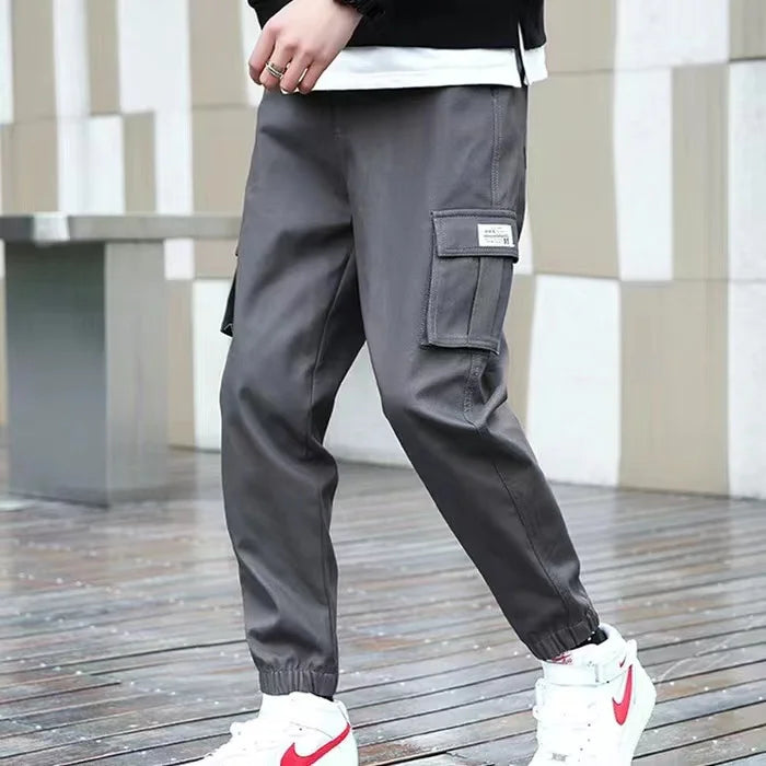 Pantalones deportivos holgados con múltiples bolsillos para primavera y verano, estilo urbano para hombre, con cordón en la cintura, pantalones cargo para fitness al aire libre.