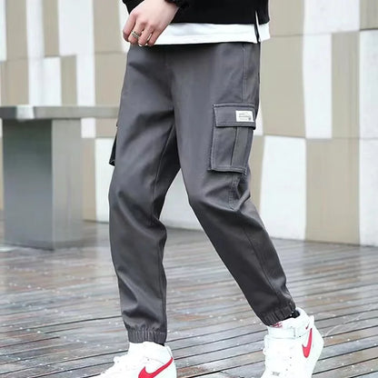 Pantalones deportivos holgados con múltiples bolsillos para primavera y verano, estilo urbano para hombre, con cordón en la cintura, pantalones cargo para fitness al aire libre.