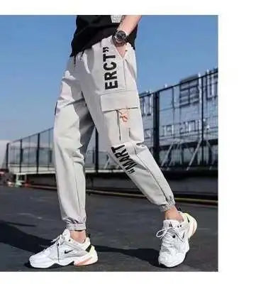 Pantalones deportivos holgados con múltiples bolsillos para primavera y verano, estilo urbano para hombre, con cordón en la cintura, pantalones cargo para fitness al aire libre.