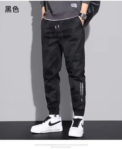 Pantalones deportivos holgados con múltiples bolsillos para primavera y verano, estilo urbano para hombre, con cordón en la cintura, pantalones cargo para fitness al aire libre.