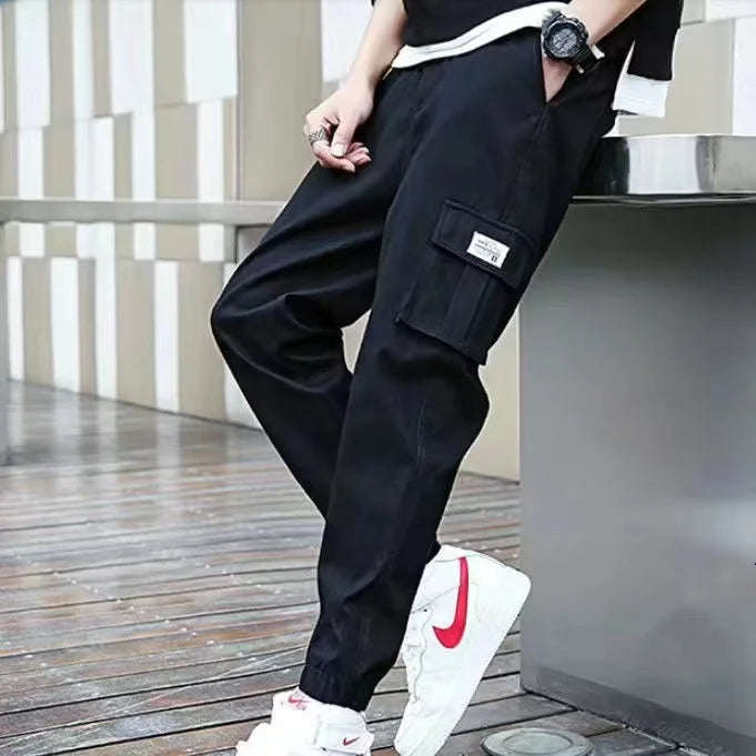 Pantalones deportivos holgados con múltiples bolsillos para primavera y verano, estilo urbano para hombre, con cordón en la cintura, pantalones cargo para fitness al aire libre.