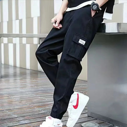 Pantalones deportivos holgados con múltiples bolsillos para primavera y verano, estilo urbano para hombre, con cordón en la cintura, pantalones cargo para fitness al aire libre.