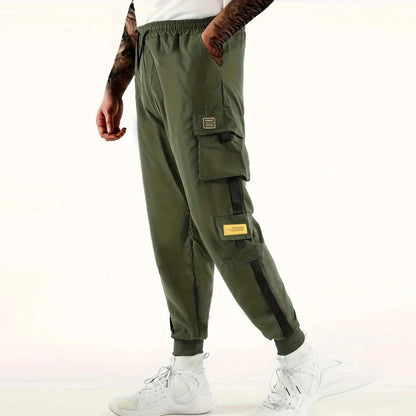 Pantalones deportivos holgados con múltiples bolsillos para primavera y verano, estilo urbano para hombre, con cordón en la cintura, pantalones cargo para fitness al aire libre.