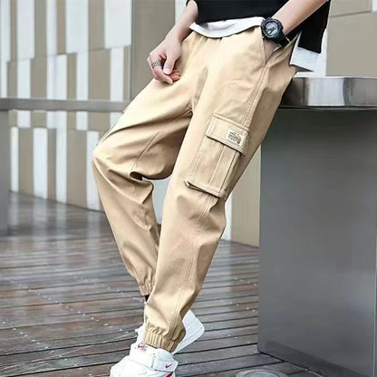 Pantalones deportivos holgados con múltiples bolsillos para primavera y verano, estilo urbano para hombre, con cordón en la cintura, pantalones cargo para fitness al aire libre.