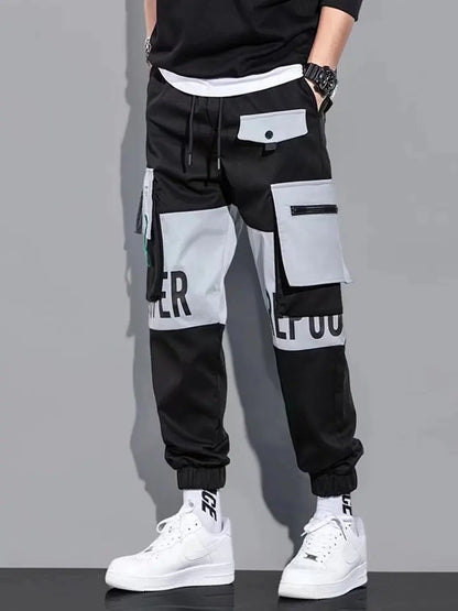 Pantalones deportivos holgados con múltiples bolsillos para primavera y verano, estilo urbano para hombre, con cordón en la cintura, pantalones cargo para fitness al aire libre.