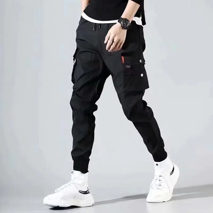 Pantalones deportivos holgados con múltiples bolsillos para primavera y verano, estilo urbano para hombre, con cordón en la cintura, pantalones cargo para fitness al aire libre.