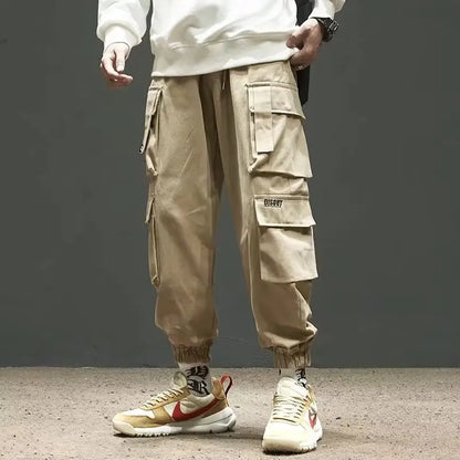 Pantalones deportivos holgados con múltiples bolsillos para primavera y verano, estilo urbano para hombre, con cordón en la cintura, pantalones cargo para fitness al aire libre.