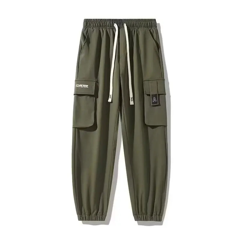 Pantalones deportivos holgados con múltiples bolsillos para primavera y verano, estilo urbano para hombre, con cordón en la cintura, pantalones cargo para fitness al aire libre.