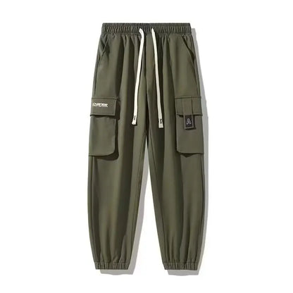 Pantalones deportivos holgados con múltiples bolsillos para primavera y verano, estilo urbano para hombre, con cordón en la cintura, pantalones cargo para fitness al aire libre.