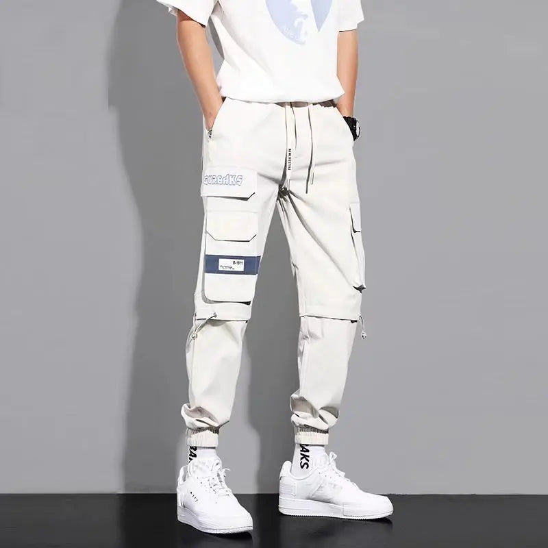 Pantalones deportivos holgados con múltiples bolsillos para primavera y verano, estilo urbano para hombre, con cordón en la cintura, pantalones cargo para fitness al aire libre.