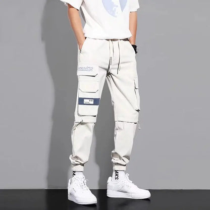 Pantalones deportivos holgados con múltiples bolsillos para primavera y verano, estilo urbano para hombre, con cordón en la cintura, pantalones cargo para fitness al aire libre.