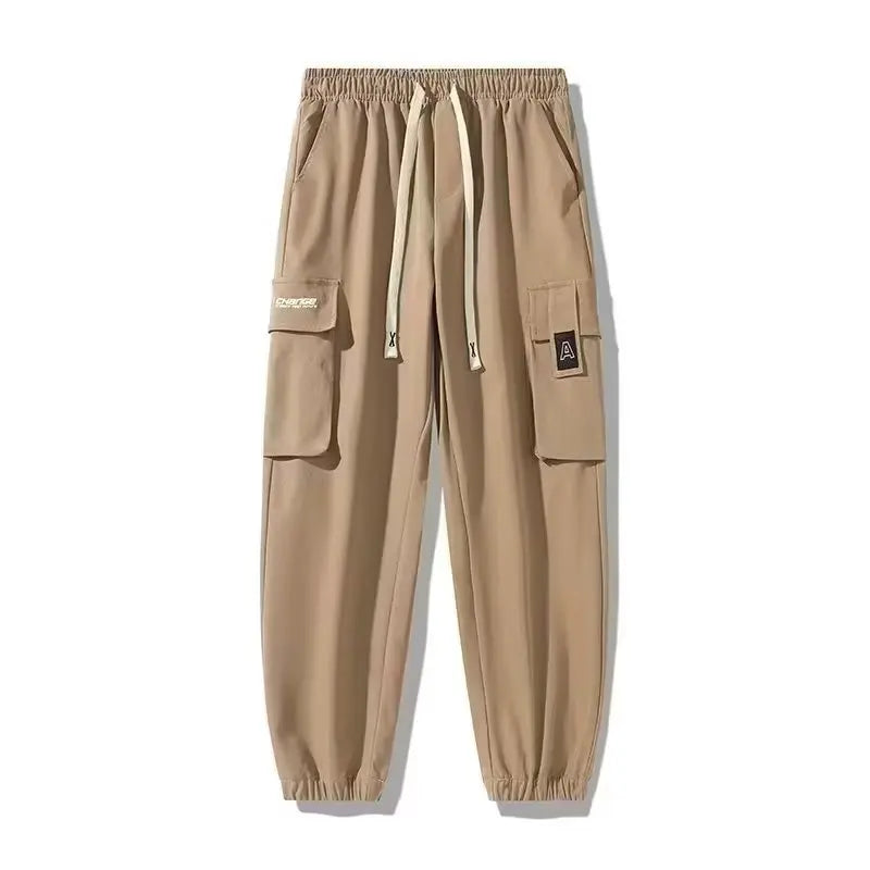 Pantalones deportivos holgados con múltiples bolsillos para primavera y verano, estilo urbano para hombre, con cordón en la cintura, pantalones cargo para fitness al aire libre.