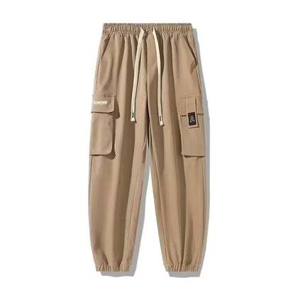 Pantalones deportivos holgados con múltiples bolsillos para primavera y verano, estilo urbano para hombre, con cordón en la cintura, pantalones cargo para fitness al aire libre.
