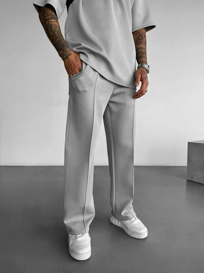Pantalones casuales nuevos para hombre, elegantes y cómodos, con cintura elástica y cordón ajustable, de una sola línea, plisados, de color sólido, con bolsillos, pantalones de fregona