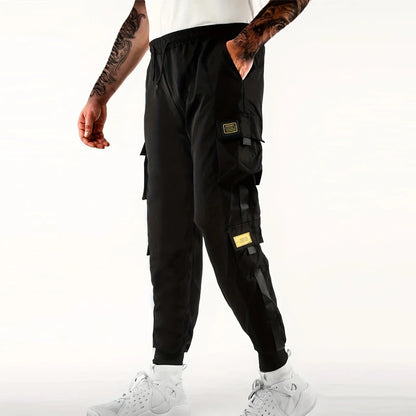 Pantalones deportivos holgados con múltiples bolsillos para primavera y verano, estilo urbano para hombre, con cordón en la cintura, pantalones cargo para fitness al aire libre.