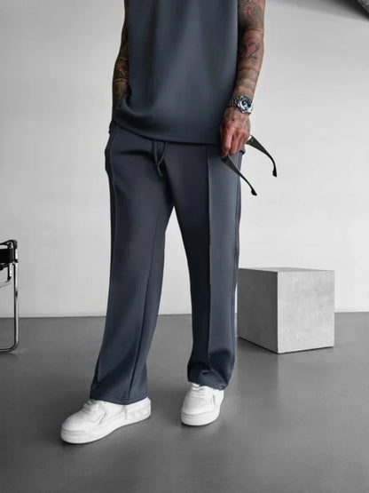 Pantalones casuales nuevos para hombre, elegantes y cómodos, con cintura elástica y cordón ajustable, de una sola línea, plisados, de color sólido, con bolsillos, pantalones de fregona