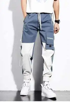 Pantalones deportivos holgados con múltiples bolsillos para primavera y verano, estilo urbano para hombre, con cordón en la cintura, pantalones cargo para fitness al aire libre.