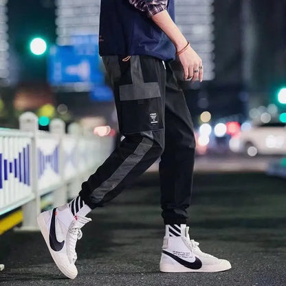 Pantalones deportivos holgados con múltiples bolsillos para primavera y verano, estilo urbano para hombre, con cordón en la cintura, pantalones cargo para fitness al aire libre.