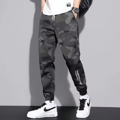Pantalones deportivos holgados con múltiples bolsillos para primavera y verano, estilo urbano para hombre, con cordón en la cintura, pantalones cargo para fitness al aire libre.