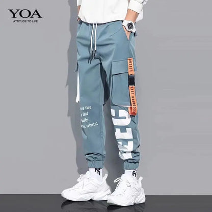 Pantalones deportivos holgados con múltiples bolsillos para primavera y verano, estilo urbano para hombre, con cordón en la cintura, pantalones cargo para fitness al aire libre.